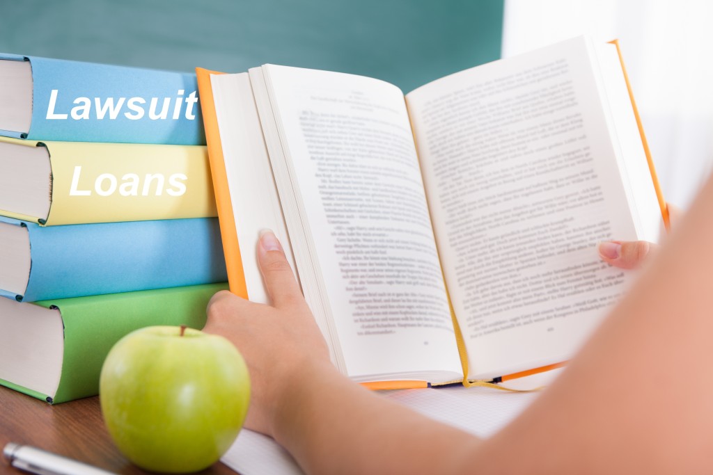 Photo Female student studying  and green apple